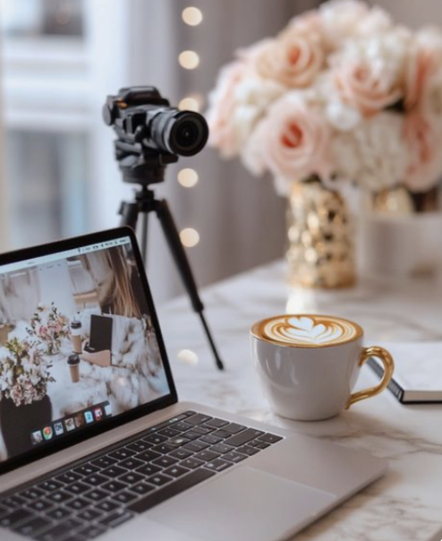 Creator desk setup with camera and laptop, business content